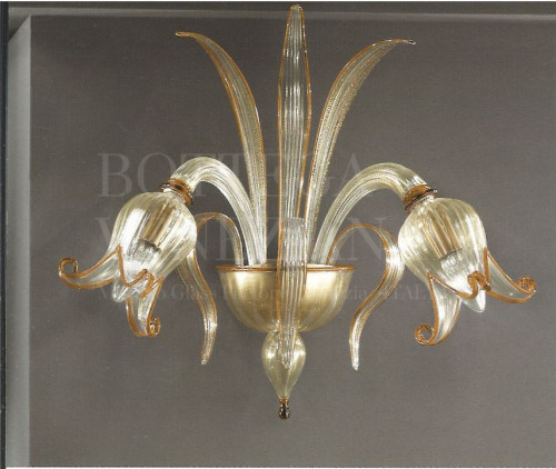 Applique modello COROLLE in vetro soffiato di Murano cristallo e ambra. Coordinata a lampadario, piantana, flambeau. Realizzata a Venezia nella fornace di Bottega Veneziana. Prodotto artigianale fatto completamente a mano in Italia